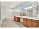 Large Primary bathroom featuring a soaking tub, dual sinks, and a huge mirror at 15101 W Waterford Dr, Surprise, AZ 85374