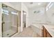 Bright bathroom features a walk-in shower, soaking tub, and dual sinks at 15101 W Waterford Dr, Surprise, AZ 85374