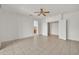 Bedroom with tile floors, a ceiling fan, and ample closet space at 15101 W Waterford Dr, Surprise, AZ 85374