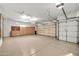 Garage with built-in cabinets and epoxy flooring at 15101 W Waterford Dr, Surprise, AZ 85374