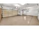 Spacious three car garage featuring painted floors at 15101 W Waterford Dr, Surprise, AZ 85374
