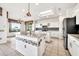Bright kitchen featuring a center island, pendant lighting, and modern appliances at 15101 W Waterford Dr, Surprise, AZ 85374