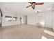 Bright living room featuring tile floors, chandelier, neutral paint, and elegant finishes at 15101 W Waterford Dr, Surprise, AZ 85374