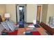 Bedroom with ensuite bath and closet doors features quilt and decorative pillows atop bed at 15221 N Clubgate Dr # 2044, Scottsdale, AZ 85254