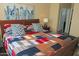 Comfortable bedroom features colorful quilt and matching decorative pillows, creating a cozy atmosphere at 15221 N Clubgate Dr # 2044, Scottsdale, AZ 85254