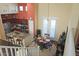 Open-concept dining area features a round table and access to the outdoors through bright, white doors at 15221 N Clubgate Dr # 2044, Scottsdale, AZ 85254