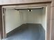 Clean garage featuring epoxy flooring, and a new automatic garage door at 15221 N Clubgate Dr # 2044, Scottsdale, AZ 85254