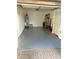 View of the spacious garage with a new epoxy floor and ample storage space at 15221 N Clubgate Dr # 2044, Scottsdale, AZ 85254
