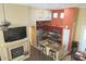 Open concept kitchen with island, stainless steel appliances, and adjacent breakfast nook at 15221 N Clubgate Dr # 2044, Scottsdale, AZ 85254