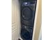 Modern, gray stackable LG washer and dryer in dedicated laundry space at 15221 N Clubgate Dr # 2044, Scottsdale, AZ 85254