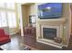 Comfortable living room with fireplace, large TV, and plenty of natural light at 15221 N Clubgate Dr # 2044, Scottsdale, AZ 85254