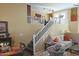 View of staircase and dining table from the kitchen island to the living area upstairs at 15221 N Clubgate Dr # 2044, Scottsdale, AZ 85254