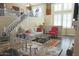 Elegant living room showcasing a comfortable sofa, stylish decor, and a view of the upper-level staircase at 15221 N Clubgate Dr # 2044, Scottsdale, AZ 85254