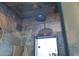 Elegant walk-in shower featuring slate-style stone tiling and a modern shower head at 15221 N Clubgate Dr # 2044, Scottsdale, AZ 85254