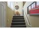 Interior staircase featuring hardwood steps, white railing, and decorative accents at 15221 N Clubgate Dr # 2044, Scottsdale, AZ 85254