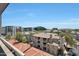 An aerial view from a balcony showcasing the complex buildings, rooftops, and surrounding landscape at 15802 N 71St St # 552, Scottsdale, AZ 85254