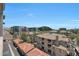 A scenic aerial view of the residential complex under a clear blue sky, showcasing multiple buildings at 15802 N 71St St # 552, Scottsdale, AZ 85254