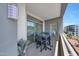 A well-furnished balcony offering a glimpse of the community with comfortable seating and greenery at 15802 N 71St St # 552, Scottsdale, AZ 85254