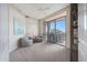 Bright bedroom featuring sitting area, ceiling fan, and balcony overlooking the city at 15802 N 71St St # 552, Scottsdale, AZ 85254