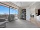 Bedroom with view of balcony, furniture, and shelving at 15802 N 71St St # 552, Scottsdale, AZ 85254