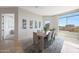 Cozy dining room features a modern table with seating for six and plenty of natural light at 15802 N 71St St # 552, Scottsdale, AZ 85254