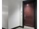 A classic entry door with modern hardware and unit number, providing secure and stylish access at 15802 N 71St St # 552, Scottsdale, AZ 85254
