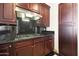 A well-appointed kitchen features a stainless steel range hood and gas cooktop at 15802 N 71St St # 552, Scottsdale, AZ 85254