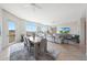 Open-concept living area with dining table and large windows, offering scenic views and ample natural light at 15802 N 71St St # 552, Scottsdale, AZ 85254