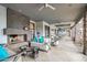 Inviting outdoor living space with a cozy fireplace, stylish seating, and access to an outdoor dining area at 15802 N 71St St # 552, Scottsdale, AZ 85254
