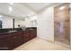 Bathroom includes dual sinks, granite counters, and walk-in shower at 15802 N 71St St # 552, Scottsdale, AZ 85254