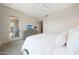Light and airy primary suite includes TV and access to outdoor living space at 15802 N 71St St # 552, Scottsdale, AZ 85254
