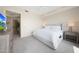 Comfortable main bedroom offers soft carpet, a ceiling fan, and soothing neutral decor at 15802 N 71St St # 552, Scottsdale, AZ 85254