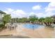 Stunning pool area with lush landscaping, a rock waterfall, and comfortable patio furniture for outdoor relaxation and entertainment at 15802 N 71St St # 552, Scottsdale, AZ 85254