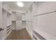 This walk-in closet has custom shelving and rods for organized storage at 15802 N 71St St # 552, Scottsdale, AZ 85254