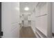 Spacious walk-in closet provides ample storage with custom shelving and organizational units at 15802 N 71St St # 552, Scottsdale, AZ 85254