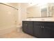 Bathroom with a double sink vanity, a shower-tub combo, and modern fixtures at 1661 N St Francis Pl, Casa Grande, AZ 85122
