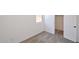This bedroom features neutral carpet, a window, and a door to a walk-in closet at 1661 N St Francis Pl, Casa Grande, AZ 85122