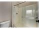 Bathroom featuring a clear glass shower, toilet, and white walls at 16846 N 49Th Way, Scottsdale, AZ 85254