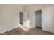 A neutral-colored bedroom featuring a closet and an open door to another room at 16846 N 49Th Way, Scottsdale, AZ 85254