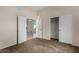 Bedroom view to living area through double doors and view to closet at 16846 N 49Th Way, Scottsdale, AZ 85254