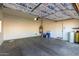 An empty garage with insulated roof panels and a water heater at 16846 N 49Th Way, Scottsdale, AZ 85254