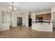 Kitchen area with a peninsula bar, black appliances, and lots of space at 16846 N 49Th Way, Scottsdale, AZ 85254
