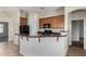 Kitchen has tile floors, granite countertops, wood cabinetry and a breakfast bar at 16846 N 49Th Way, Scottsdale, AZ 85254