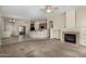 Open living space with fireplace and views into the kitchen and dining area at 16846 N 49Th Way, Scottsdale, AZ 85254