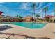 Community pool with lounge chairs and palm trees set under a partially cloudy sky at 16846 N 49Th Way, Scottsdale, AZ 85254