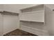 Interior of walk-in closet featuring carpet and multiple hanging bars at 16846 N 49Th Way, Scottsdale, AZ 85254