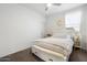 Bright bedroom featuring an all-white design with light wood accents and a bench at 17140 W Running Deer Trl, Surprise, AZ 85387