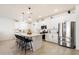 Bright kitchen featuring white cabinets, stainless appliances, and a large island perfect for entertaining at 17140 W Running Deer Trl, Surprise, AZ 85387