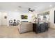 Cozy living room with neutral tones, a mounted TV, and stylish decor at 17140 W Running Deer Trl, Surprise, AZ 85387