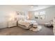 Serene main bedroom with a plush bed, neutral colors, and lots of natural light at 17140 W Running Deer Trl, Surprise, AZ 85387